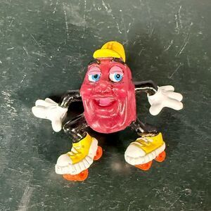 Vintage California Grapevine Raisin Roller Skater Figurine. Retired 1988